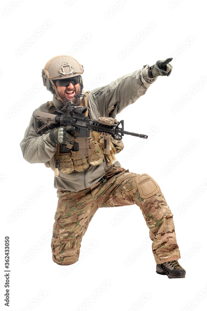 American ranger in military equipment and with a rifle aiming and shoots on a white background, portrait of a special forces soldier with weapons American ranger in military equipment and with a rifle aiming and shoots on a white background, portrait of a special forces soldier with weapons