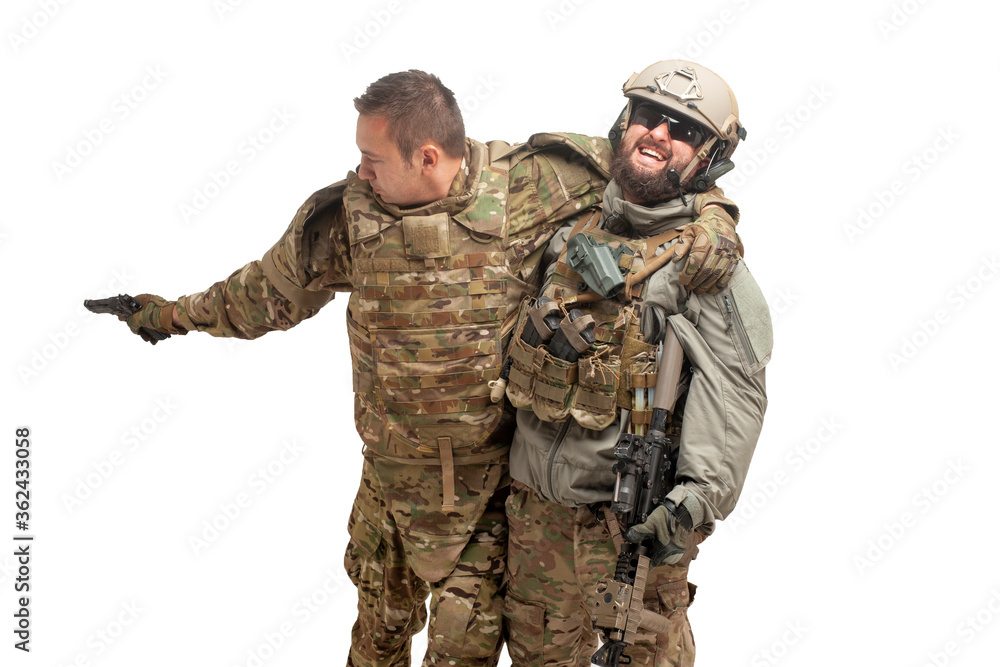 Fototapeta premium wounded American special forces soldier rescues a wounded comrade on a white background, military battle