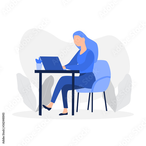 Girl sitting on the chair and working on laptop