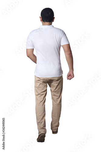 Full length portrait of Asian man wearing white shirt and khaki jeans standing walking, rear view