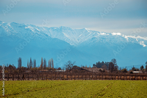 Paisaje de montaña y campo. Campo de Chile, luego de una lluvia y una nevada en la cordillera photo