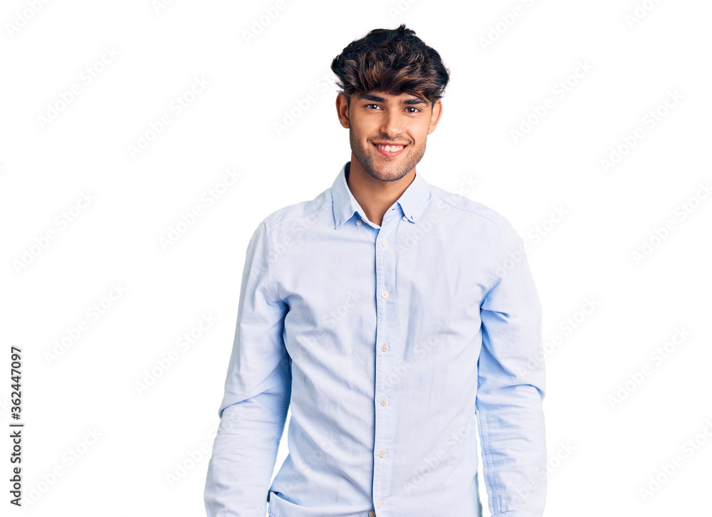 Young hispanic man wearing casual shirt with a happy and cool smile on face. lucky person. Young hispanic man wearing casual shirt with a happy and cool smile on face. lucky person.