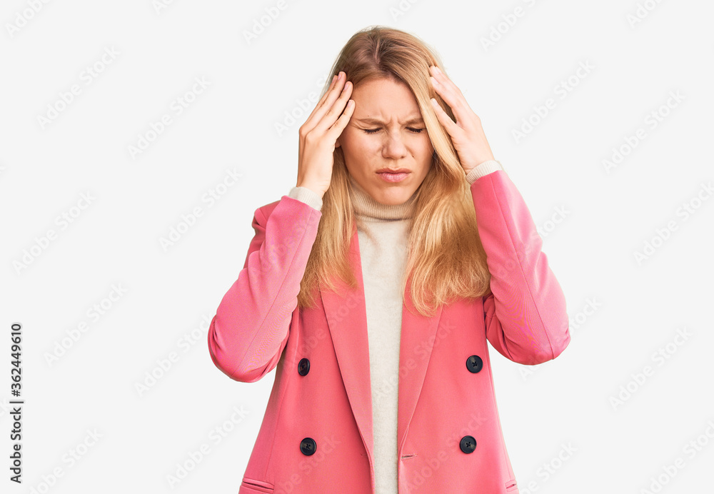 Young beautiful blonde woman wearing elegant clothes with hand on head for pain in head because stress. suffering migraine. Young beautiful blonde woman wearing elegant clothes with hand on head for pain in head because stress. suffering migraine.