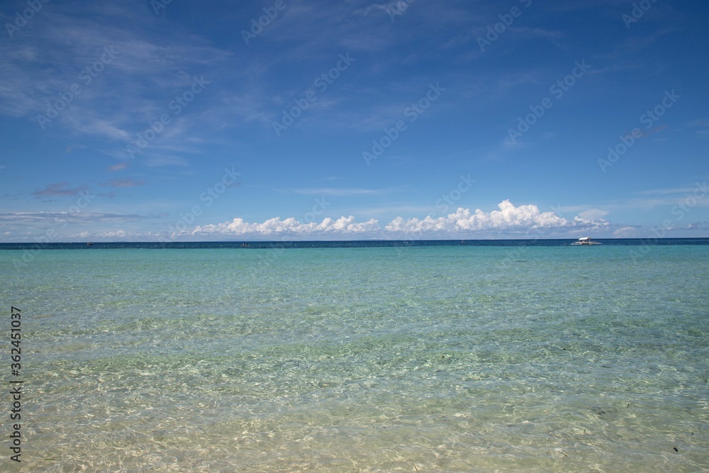 deserted white sand  beach with clear water and clear sky