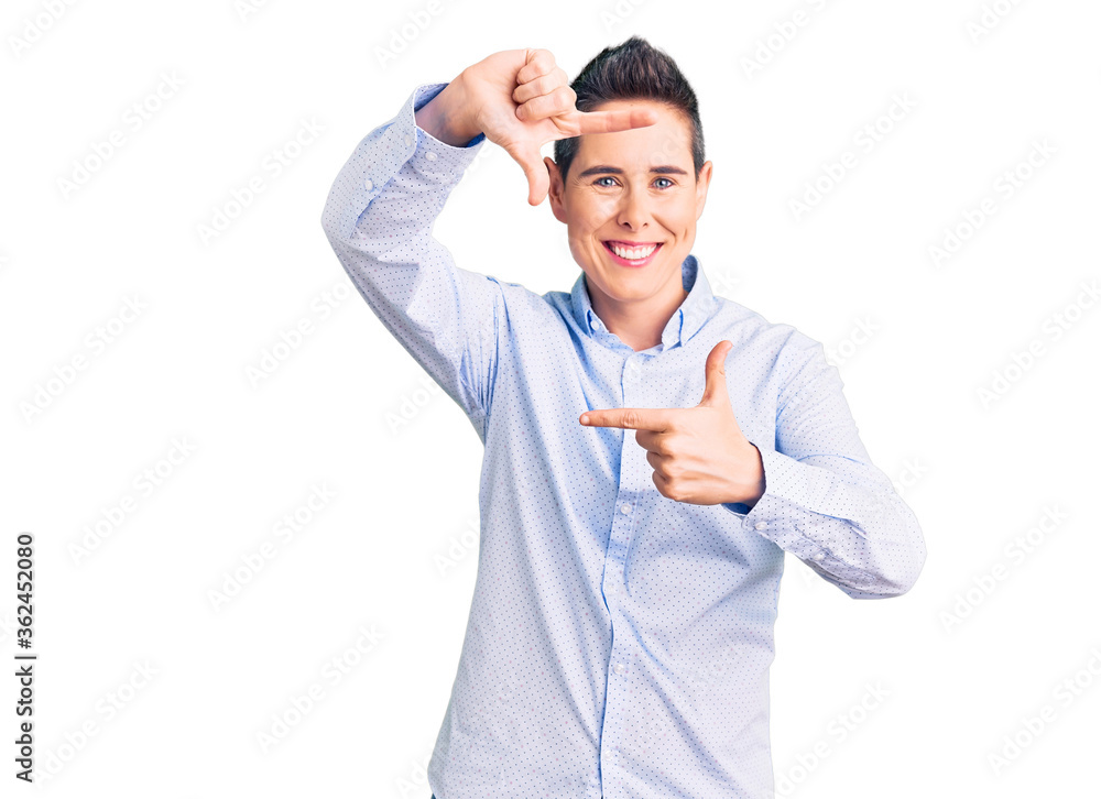 Young woman with short hair wearing business clothes smiling making frame with hands and fingers with happy face. creativity and photography concept. Young woman with short hair wearing business clothes smiling making frame with hands and fingers with happy face. creativity and photography concept.