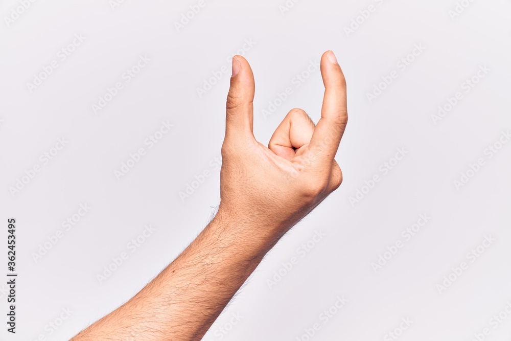 Close up of hand of young caucasian man over isolated background picking and taking invisible thing, holding object with fingers showing space Close up of hand of young caucasian man over isolated background picking and taking invisible thing, holding object with fingers showing space