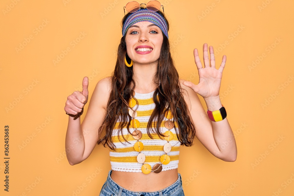 Young beautiful hippie woman with blue eyes wearing accesories and sunnglasses showing and pointing up with fingers number six while smiling confident and happy. Young beautiful hippie woman with blue eyes wearing accesories and sunnglasses showing and pointing up with fingers number six while smiling confident and happy.
