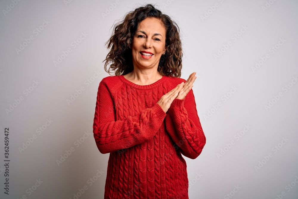 Middle age brunette woman wearing casual sweater standing over isolated white background clapping and applauding happy and joyful, smiling proud hands together Middle age brunette woman wearing casual sweater standing over isolated white background clapping and applauding happy and joyful, smiling proud hands together