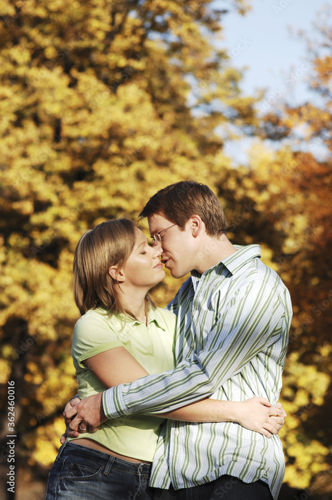 Couple kissing in the park Couple kissing in the park