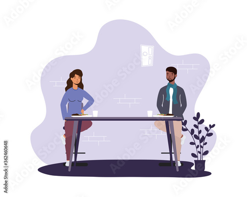interracial couple dinning in restaurant practicing social distancing ,covid19 prevention method