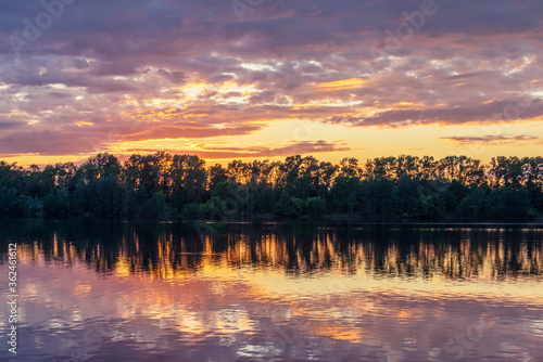 Twilight over the river and forest. Landscape of the middle plain of Russia.