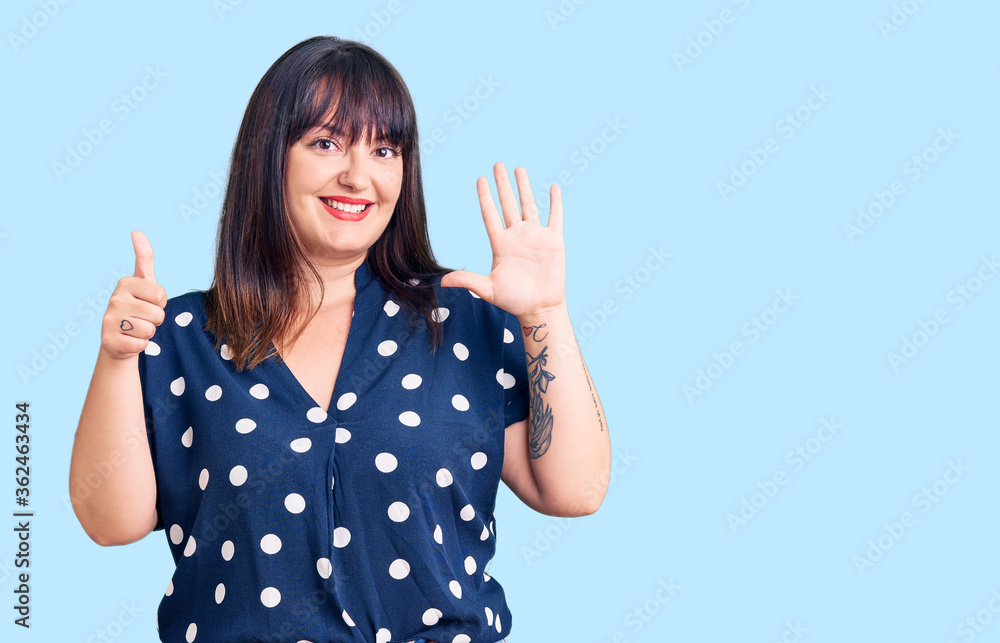 Young plus size woman wearing casual clothes showing and pointing up with fingers number six while smiling confident and happy. Young plus size woman wearing casual clothes showing and pointing up with fingers number six while smiling confident and happy.
