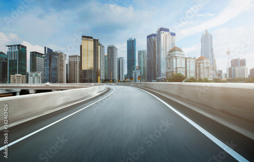 Highway overpass motion blur effect with modern city background - Image.