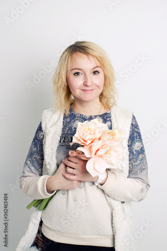 Blonde girl holding a big flower