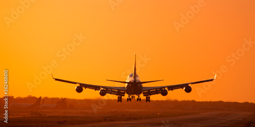 747  Jumbo Jet landing at sunset