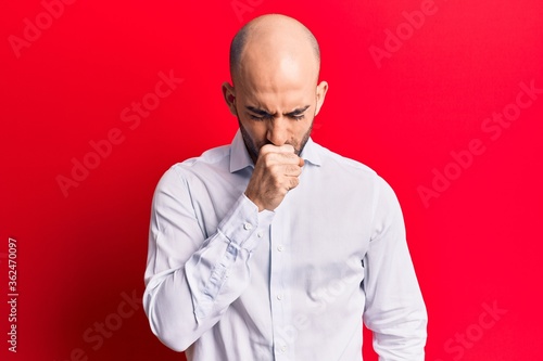 Young handsome bald man wearing elegant shirt feeling unwell and coughing as symptom for cold or bronchitis. health care concept.