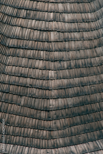 Old wooden medieval tiles, ancient roof building technology. Original background, texture, pattern.