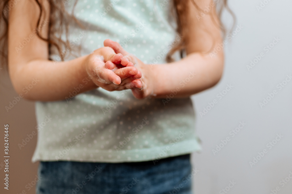 Children's hands in soapy foam. Prevention of infection and dissemination of coronavirus, quarantine Children's hands in soapy foam. Prevention of infection and dissemination of coronavirus, quarantine