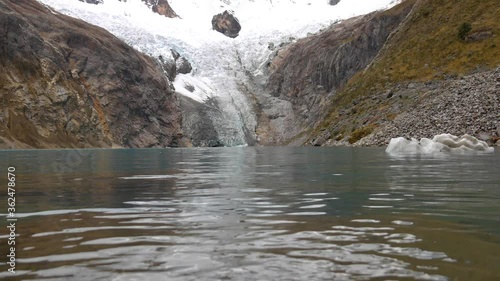 Water of the lake arhuaycocha, global warming effect, glacier water, peru, the andes photo