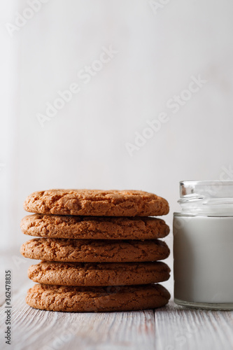 Wallpaper Mural Tasty cookies and a glass of milk in a transparent glass on a rustic white background. Copy space Torontodigital.ca