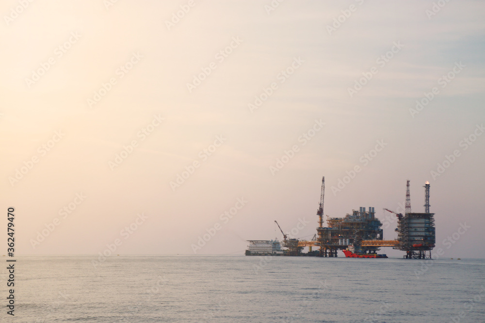 Offshore construction platform for production oil and gas. Oil and gas industry and hard work. Production platform and operation process by manual and auto function from control room.
