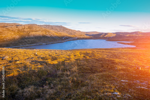 Beautiful lake at sunset. Wild nature of Norway. Nordkapp, Mageroya island
