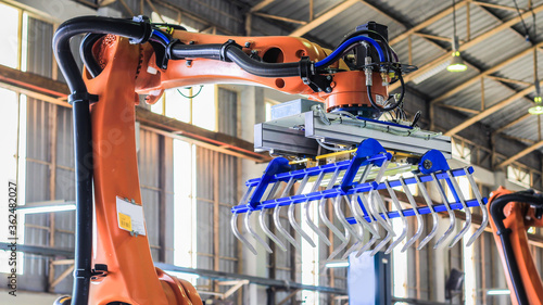 Automation concept: View of gripper unit on industrial robot in smart warehouse. photo