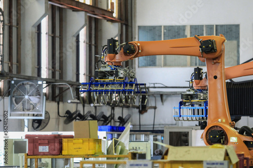 Automation concept: View of gripper unit on industrial robot in smart warehouse.