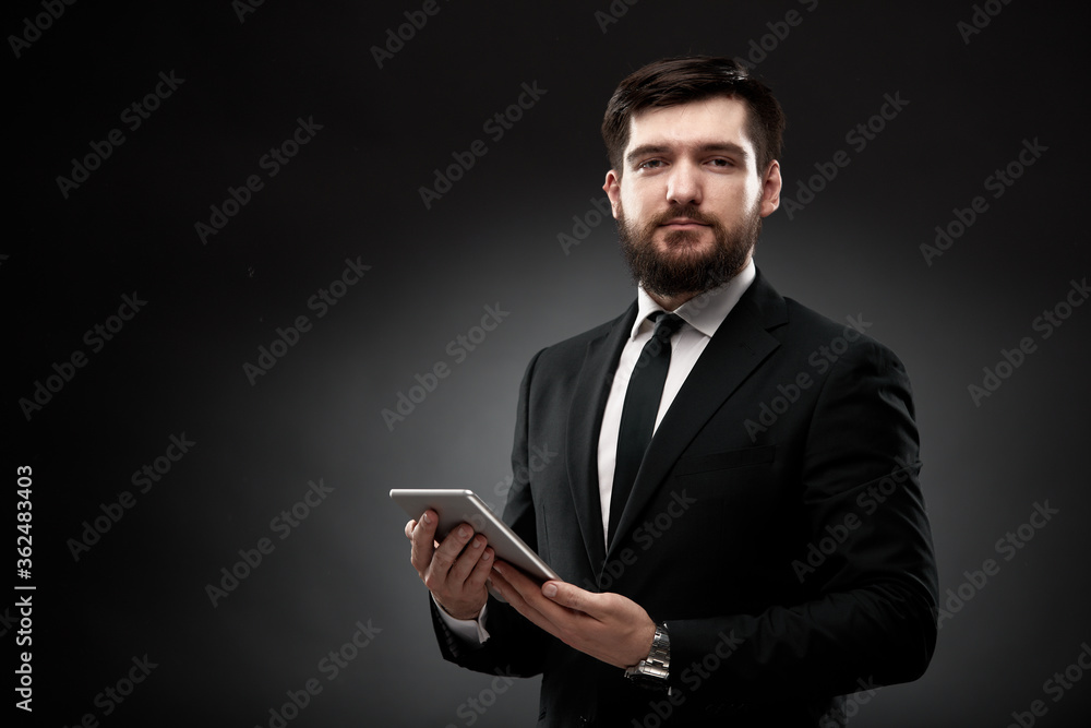 Businessman holding tablet in hands Businessman holding tablet in hands