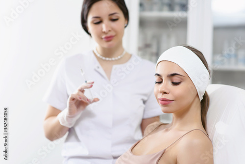 Beautician doctor cosmetologist at work. Biorevitalization cosmetology injection. Face skin treatment hyaluronic acid. Beauty facial filling. Filler. Botox procedure. Healthcare beauty concept