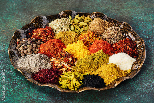 Fototapeta Naklejka Na Ścianę i Meble -  Various spice and dried herbs on oriental plate.