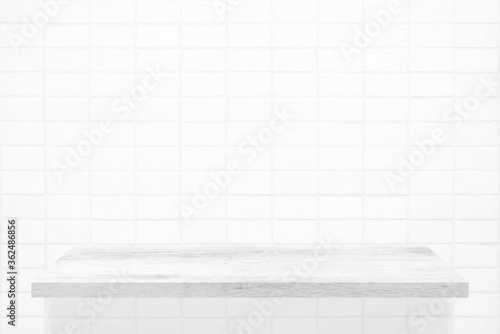 White Wooden Shelf on Mosaic Tile Wall Texture Background.