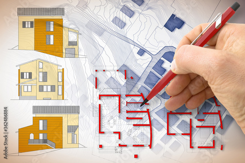 Architect drawing a new residential building over an imaginary cadastral map of territory