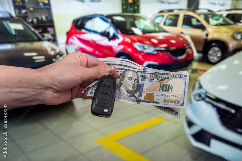 businessman purchase new car in showroom giving dollars money and taking keys from car businessman purchase new car in showroom giving dollars money and taking keys from car
