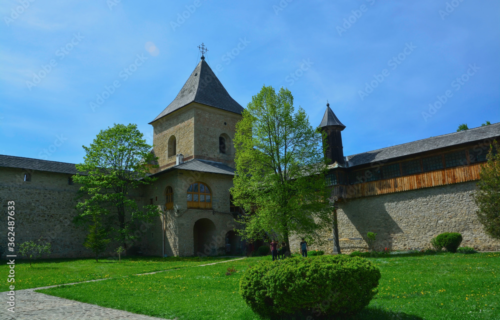 SUCEVITE MONASTERY, BUCOVINA, ROMANIA, EUROPE, SPRING 2018. One of the four towers that are inside the stone wall that surrounds the Orthodox monastery. Moldovan architectural style.