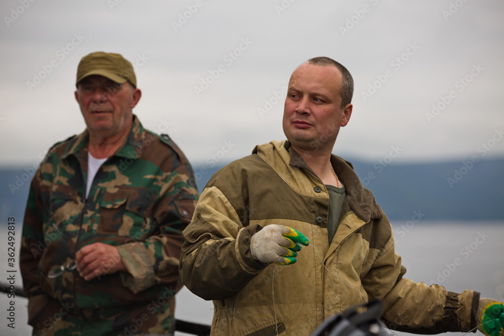 Fisherman at work, Sea of Okhotsk.