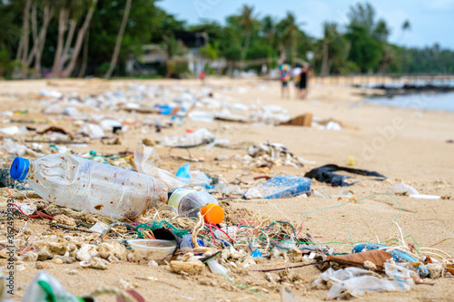 Beach pollution. Plastic bottles and other trash on the beach