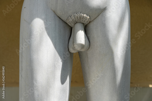 Detail marble statue of male genitals. Public sculpture detail of a young man in tropical garden in Danang, Vietnam