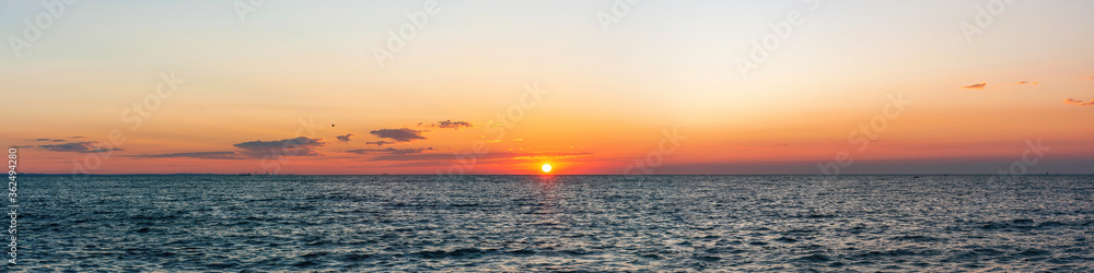 Beautiful sunrise over the sea. Panorama banner or print.
