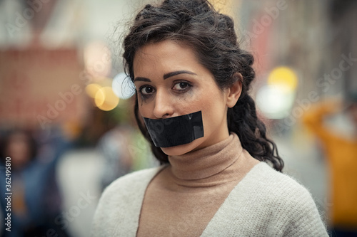 Woman protesting for domestic violence photo