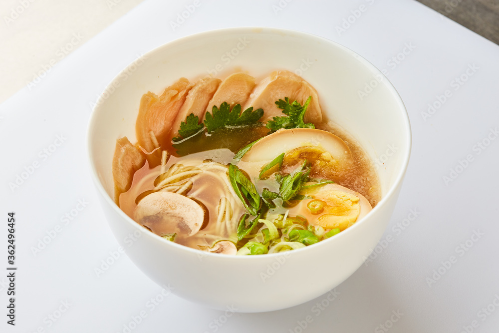 Japanese ramen soup with chicken, egg, chives  - traditional Asian dish