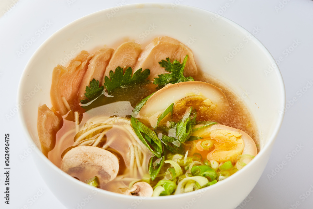 Japanese ramen soup with chicken, egg, chives - traditional Asian dish Japanese ramen soup with chicken, egg, chives - traditional Asian dish