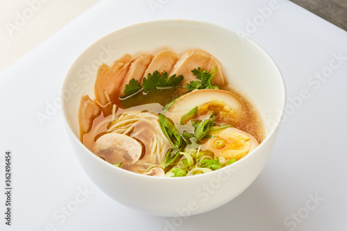 Japanese ramen soup with chicken, egg, chives - traditional Asian dish