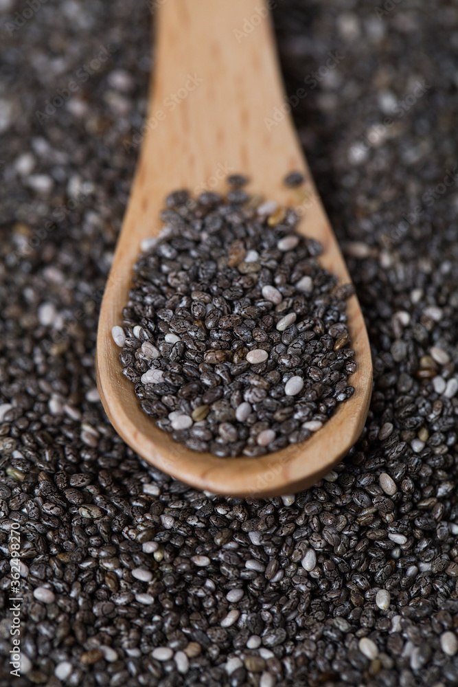 Wooden spoon with Chia seeds . Concept of a healthy diet. Wooden spoon with Chia seeds . Concept of a healthy diet.