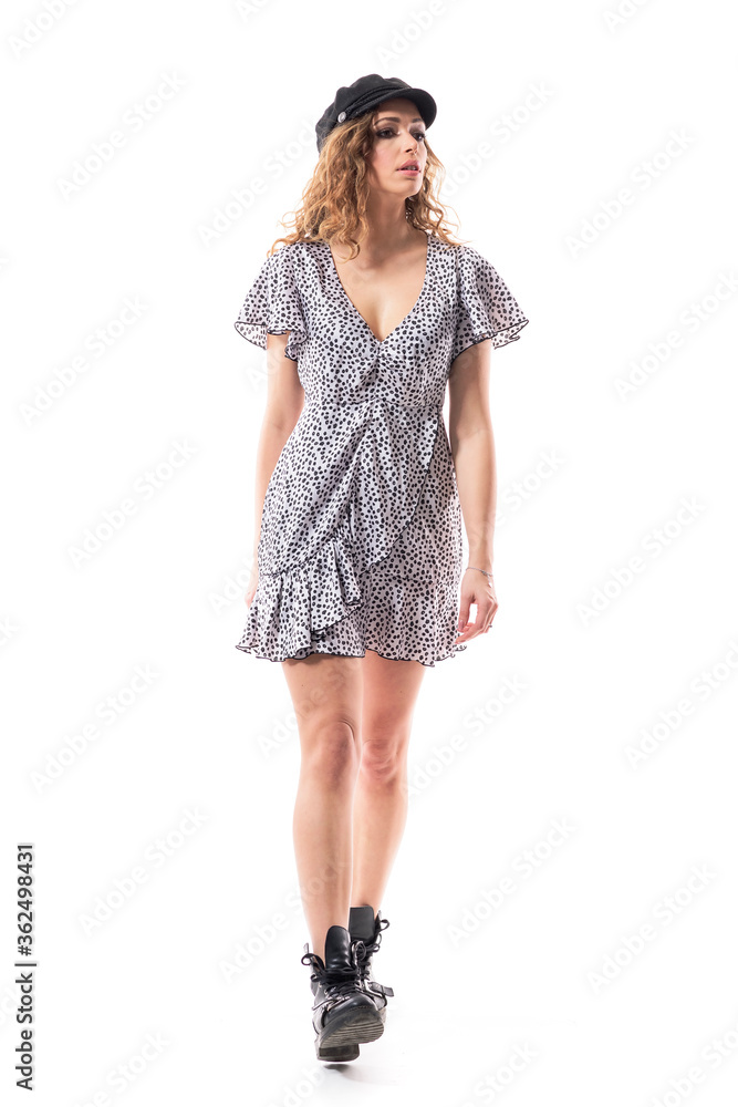 Self assured confident young woman walking relaxed looking away distracted at attention. Full length isolated on white background. Self assured confident young woman walking relaxed looking away distracted at attention. Full length isolated on white background.