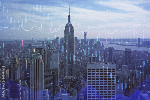 Forex graph on city view with skyscrapers background double exposure. Financial analysis concept.