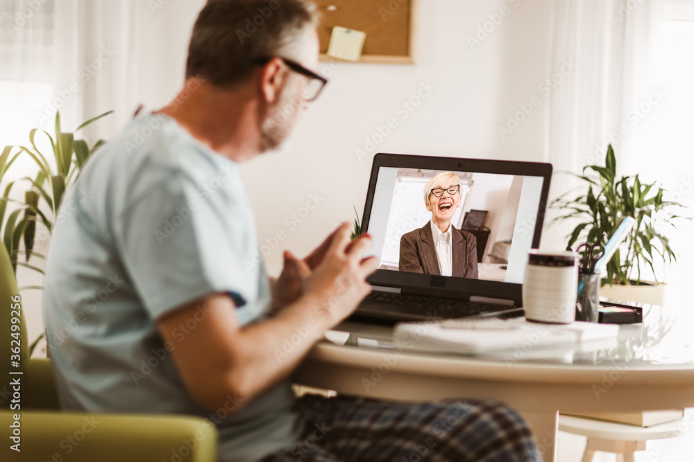 Businessman chatting with his colleague. Working at home. Businessman chatting with his colleague. Working at home.