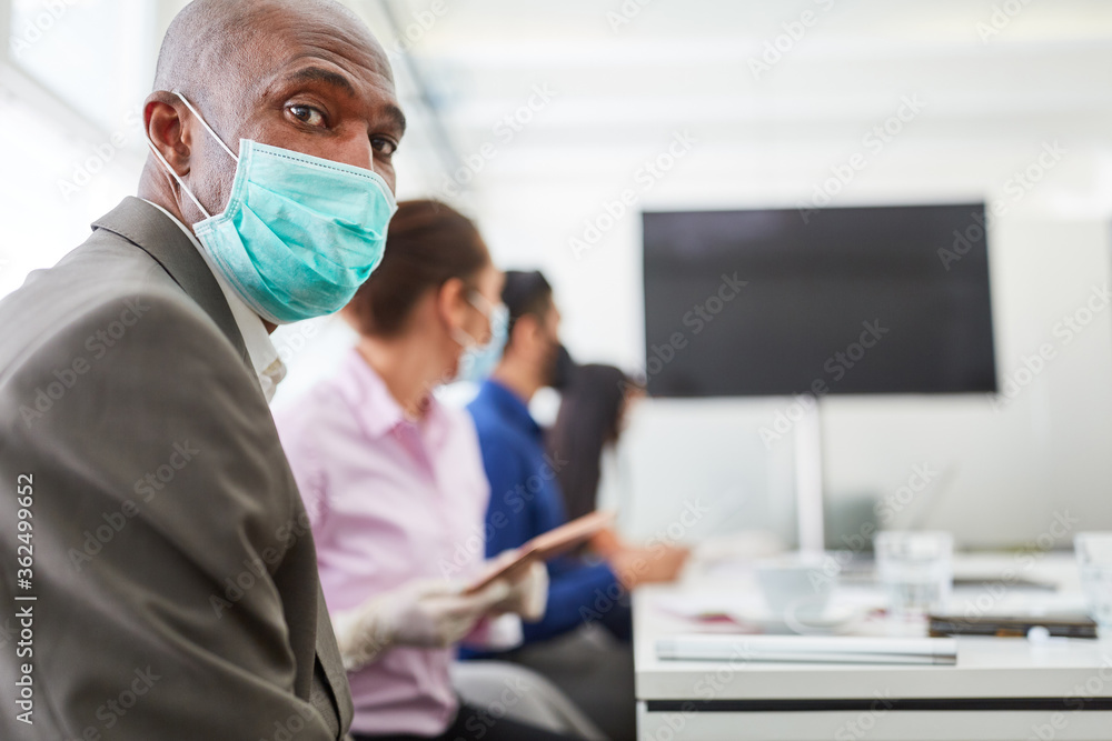 African business man with mask in a meeting African business man with mask in a meeting