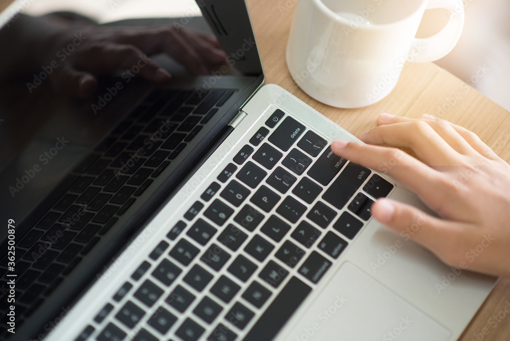 Close-up Hand on Laptop in the workplace. Business concept and Digital Technology for work. Close-up Hand on Laptop in the workplace. Business concept and Digital Technology for work.