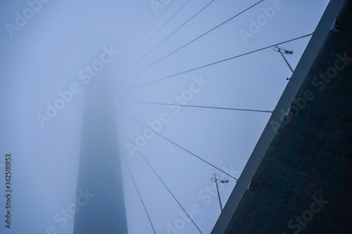 Construction of the Golden bridge in the fog.
